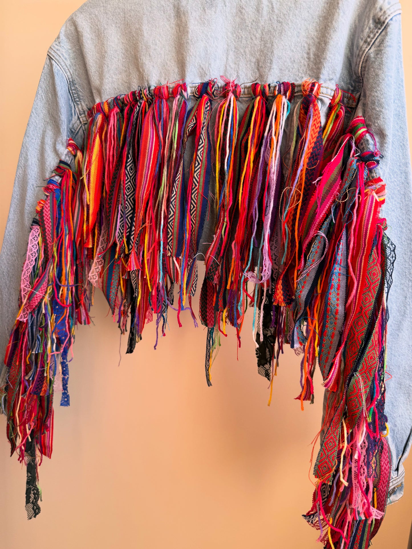 aaaTASSELBoho’ cropped denim jacket