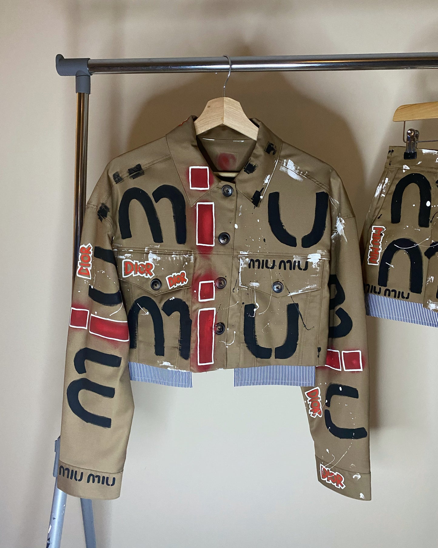 zMUIGRAFFITI’ skirt and jacket set.