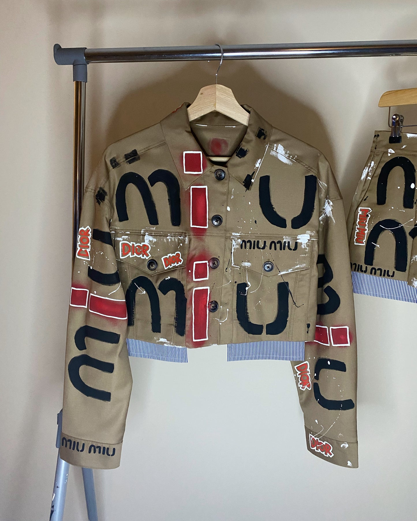 zMUIGRAFFITI’ skirt and jacket set.