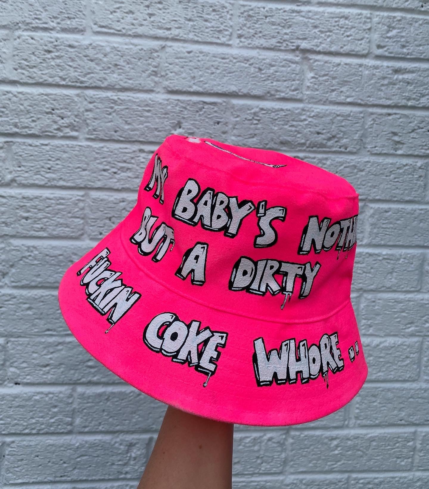 ‘zzBABYS NOTHING BUT A..’ bucket hat
