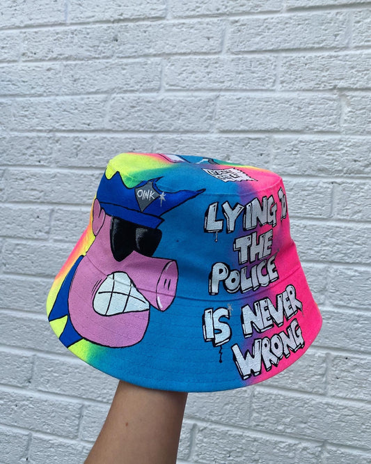 ‘zLYING TO THE PIGS’ bucket hat