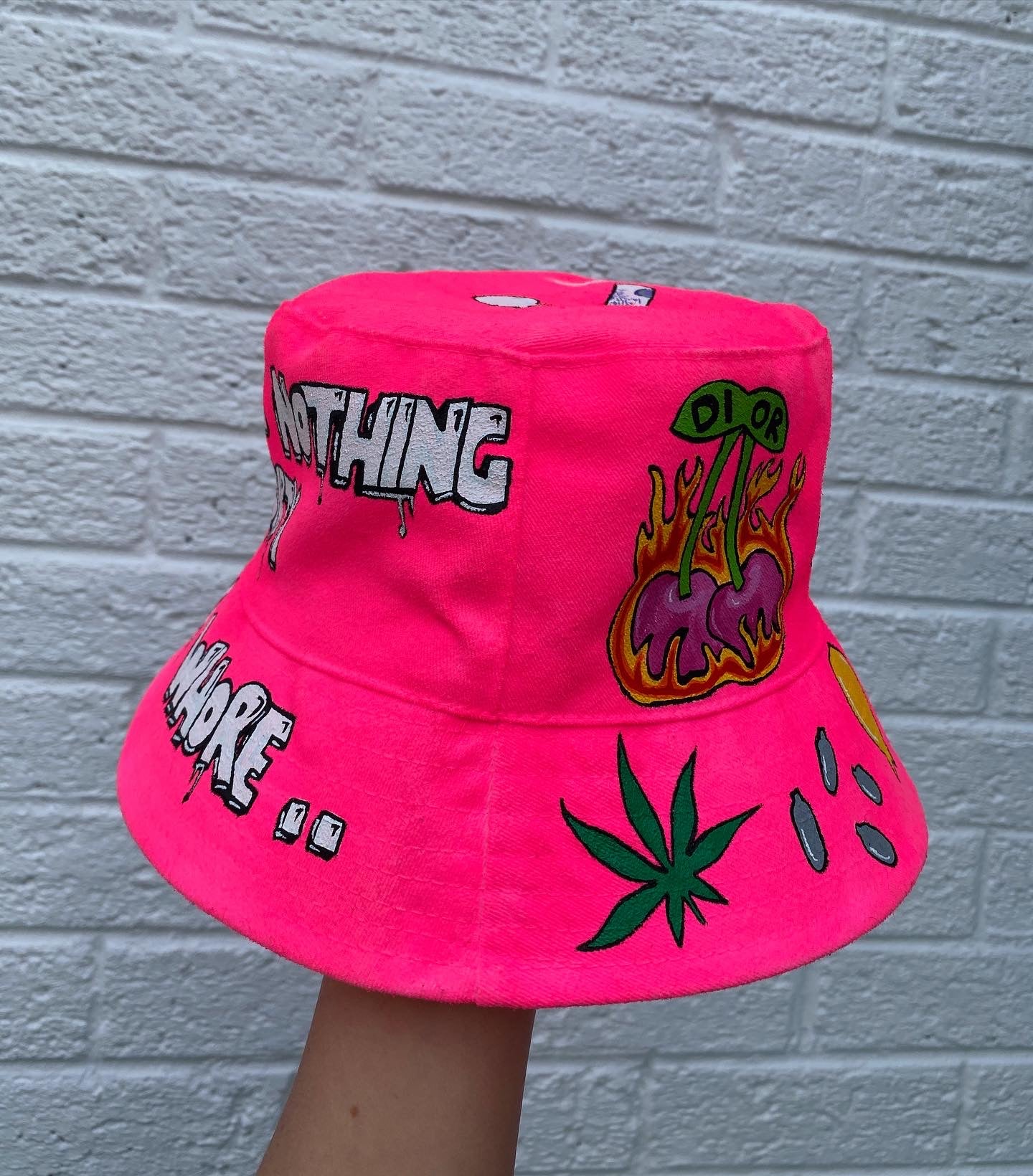 ‘zzBABYS NOTHING BUT A..’ bucket hat