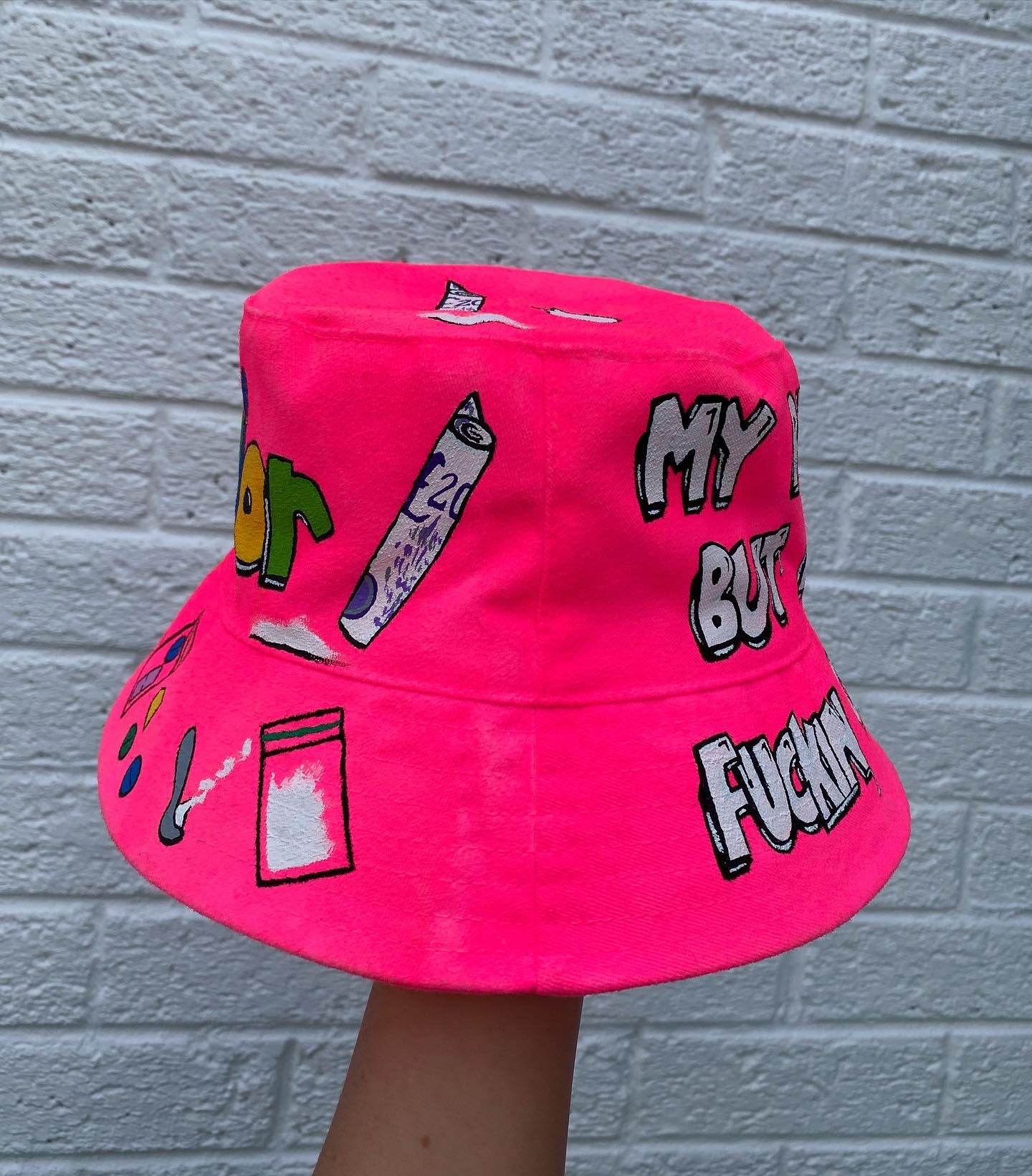 ‘zzBABYS NOTHING BUT A..’ bucket hat